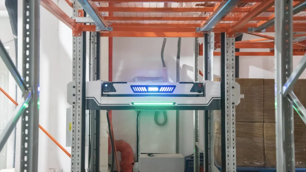 Four-way shuttle and lift working together in automated storage and retrieval system
