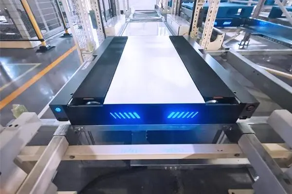 a modern automated warehouse with a four way shuttle system for high density storage, fast pallet handling, and intelligent automation.