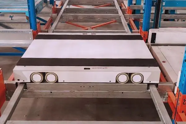 automated pallet storage system in a modern distribution center, featuring high density racking and efficient four way shuttle operations.